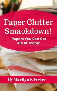Book cover of Paper Clutter Smackdown! Papers You Can Get Rid of Today! by Marilyn K Foster, featuring stacks of cluttered paperwork and a bright pink title design.